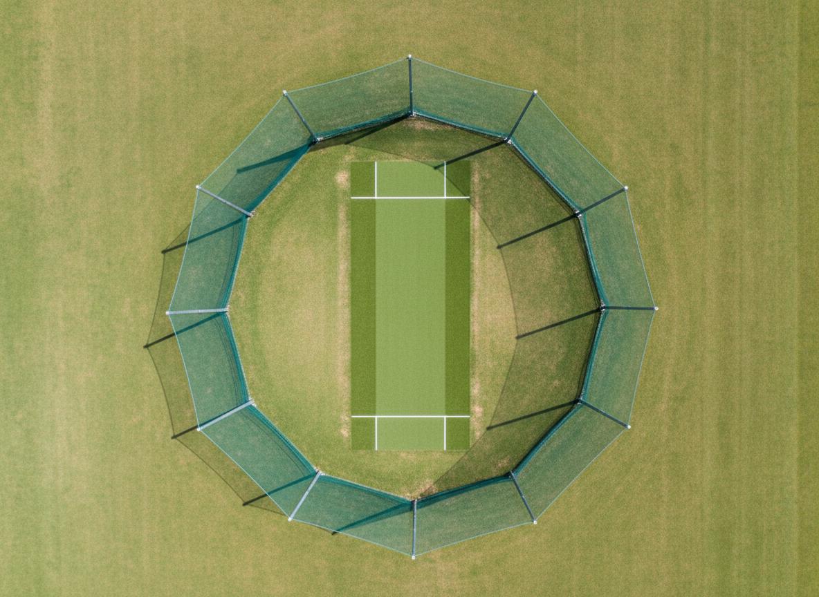 Aerial view of cricket turf pitch with natural Bermuda grass and synthetic coir matting for all-weather play