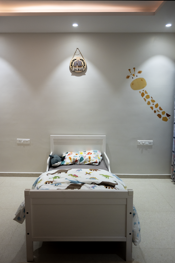 Executed children’s bedroom with giraffe wall detail and single bed